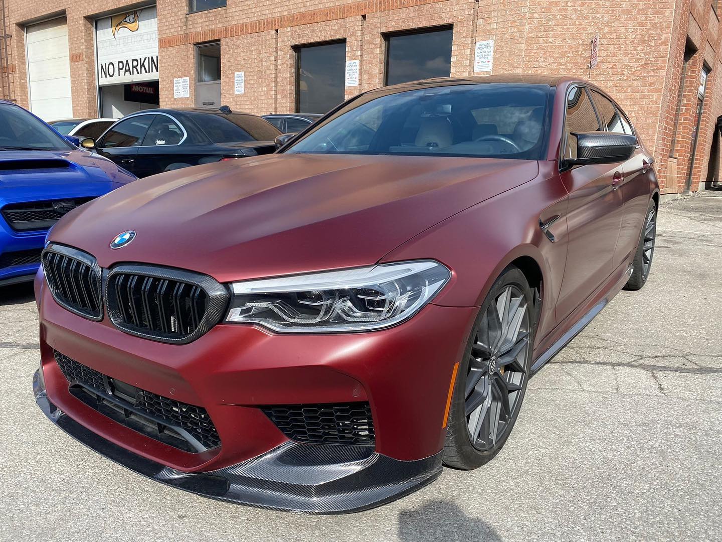 Matte maroon BMW M5 F90 at White Eagle Motors
